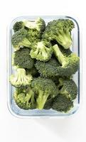 Washed And Sliced Broccoli Crown In Glass Container.V photo