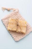 Handmade natural soap on pastel background. photo