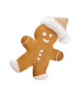 hombre de pan de jengibre, galletas y decoración navideña sobre fondo pastel. foto