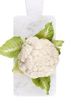 A head of fresh cauliflower. Healthy eating and vegetarianism. Color background. photo