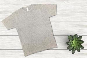 Blanks T-Shirt on Wood Background, Empty T-Shirt, T-Shirt Mockup photo