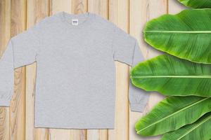 Blanks T-Shirt on Wood Background, Empty T-Shirt, T-Shirt Mockup photo