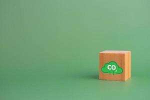 Net zero and carbon credit with wood cube block icon co2 eco on green background. photo