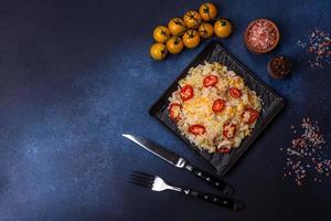 Homemade chinese fried rice with vegetables and a chicken photo