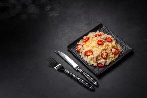 Homemade chinese fried rice with vegetables and a chicken photo