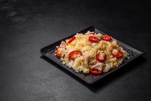 Homemade chinese fried rice with vegetables and a chicken photo