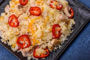 Homemade chinese fried rice with vegetables and a chicken photo