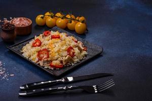 Homemade chinese fried rice with vegetables and a chicken photo