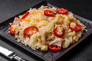Homemade chinese fried rice with vegetables and a chicken photo