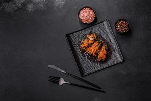 Dolma, stuffed grape leaves with rice and meat on a dark background photo