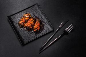 Dolma, stuffed grape leaves with rice and meat on a dark background photo