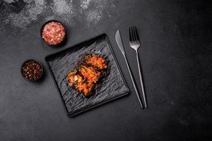 Dolma, stuffed grape leaves with rice and meat on a dark background photo