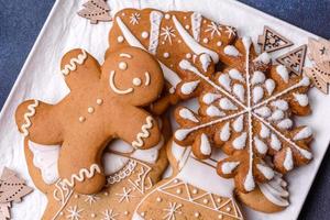 Christmas decorations and gingerbreads on a dark concrete table. Getting ready to celebration photo