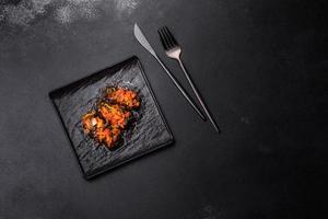 Dolma, stuffed grape leaves with rice and meat on a dark background photo