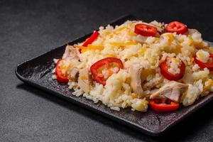 Homemade chinese fried rice with vegetables and a chicken photo