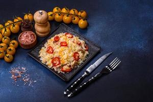 Homemade chinese fried rice with vegetables and a chicken photo