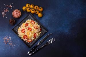 Homemade chinese fried rice with vegetables and a chicken photo