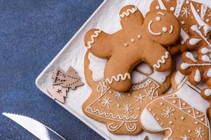 Christmas decorations and gingerbreads on a dark concrete table. Getting ready to celebration photo
