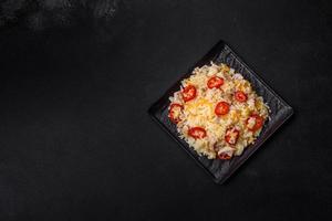 Homemade chinese fried rice with vegetables and a chicken photo