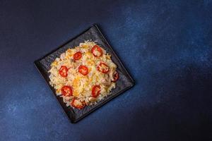 Homemade chinese fried rice with vegetables and a chicken photo