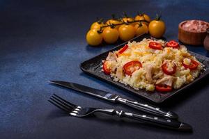 Homemade chinese fried rice with vegetables and a chicken photo