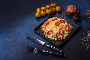 Homemade chinese fried rice with vegetables and a chicken photo