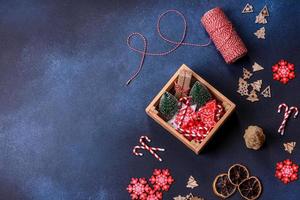 Christmas composition made of christmas decoration on a dark background. photo