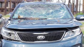 Car riddled with bullets. War in Ukraine. Shot car of civilians while trying to evacuate from the combat zone in the Kyiv region. Traces of bullets in the back of a car. Ukraine, Irpin - May 12, 2022. video