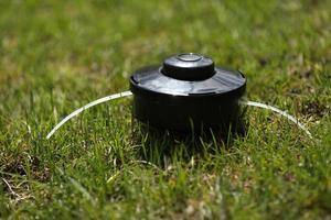 automatic sprinkler system watering the lawn on a background of green grass, close up photo