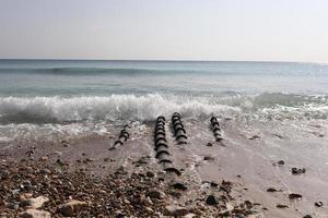 Sewer pipes go to sea. copy space. water pollution in the sea by industrial waste photo