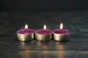 burning candle photo studio gold light of purple candle
