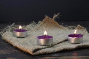 burning candle photo studio gold light of purple candle