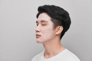 Cosmetology man portrait with mud healthy scrub photo