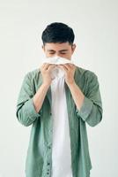 Sick guy isolated has runny nose. photo
