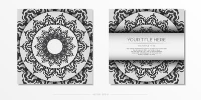 postcard in white with black ornaments. Invitation card design with mandala patterns. vector