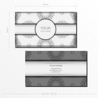 Stylish business cards with vintage patterns. Vector Ready-to-print white color business card design with greek luxury patterns.