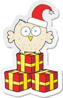 sticker of a cartoon little owl wearing christmas hat vector