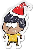 pegatina angustiada caricatura de un niño curioso con gorro de Papá Noel vector