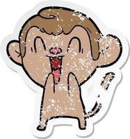 distressed sticker of a cartoon laughing monkey vector