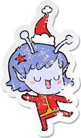 happy alien girl distressed sticker cartoon of a wearing santa hat vector