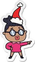 sticker cartoon of a pointing woman wearing spectacles wearing santa hat vector