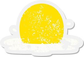 a fried egg grunge sticker vector