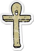 distressed sticker of a cartoon ankh symbol vector