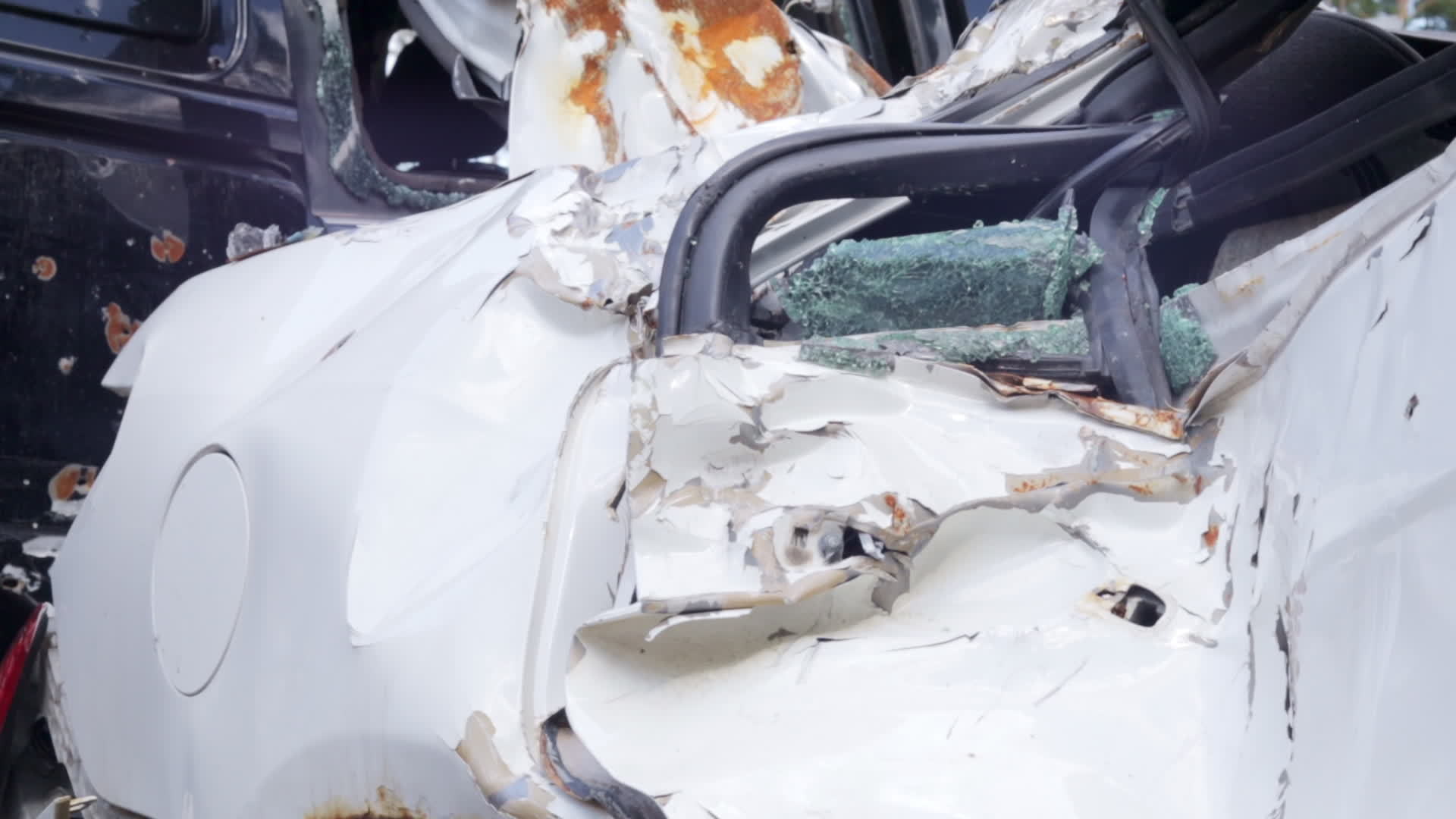 Car riddled with bullets. War in Ukraine. Shot car of civilians while trying to evacuate from