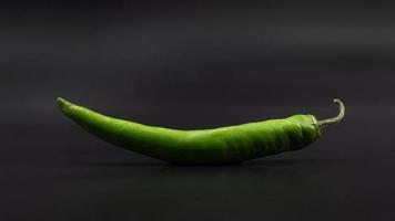 green chili pepper on a gray background photo