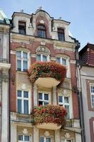 Poznan, Poland - September 16, 2014. Red house with red flowers in Poznan photo