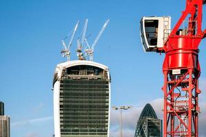 London, UK. Red crane operating in London photo