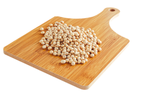 Several soybeans on a wooden cutting board on a white background with a clipping path. png