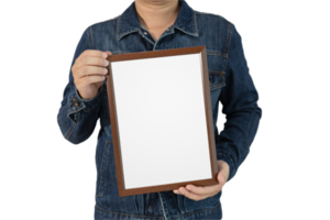 A blank diploma or a mockup certificate in the hand of a male person wearing a denim shirt on a gradient gray background with a clipping path. The picture frame is empty and the copy space. png