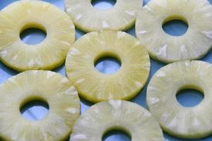 Background of pineapple rings on a plate background. Delicious breakfast of pineapple rings. photo